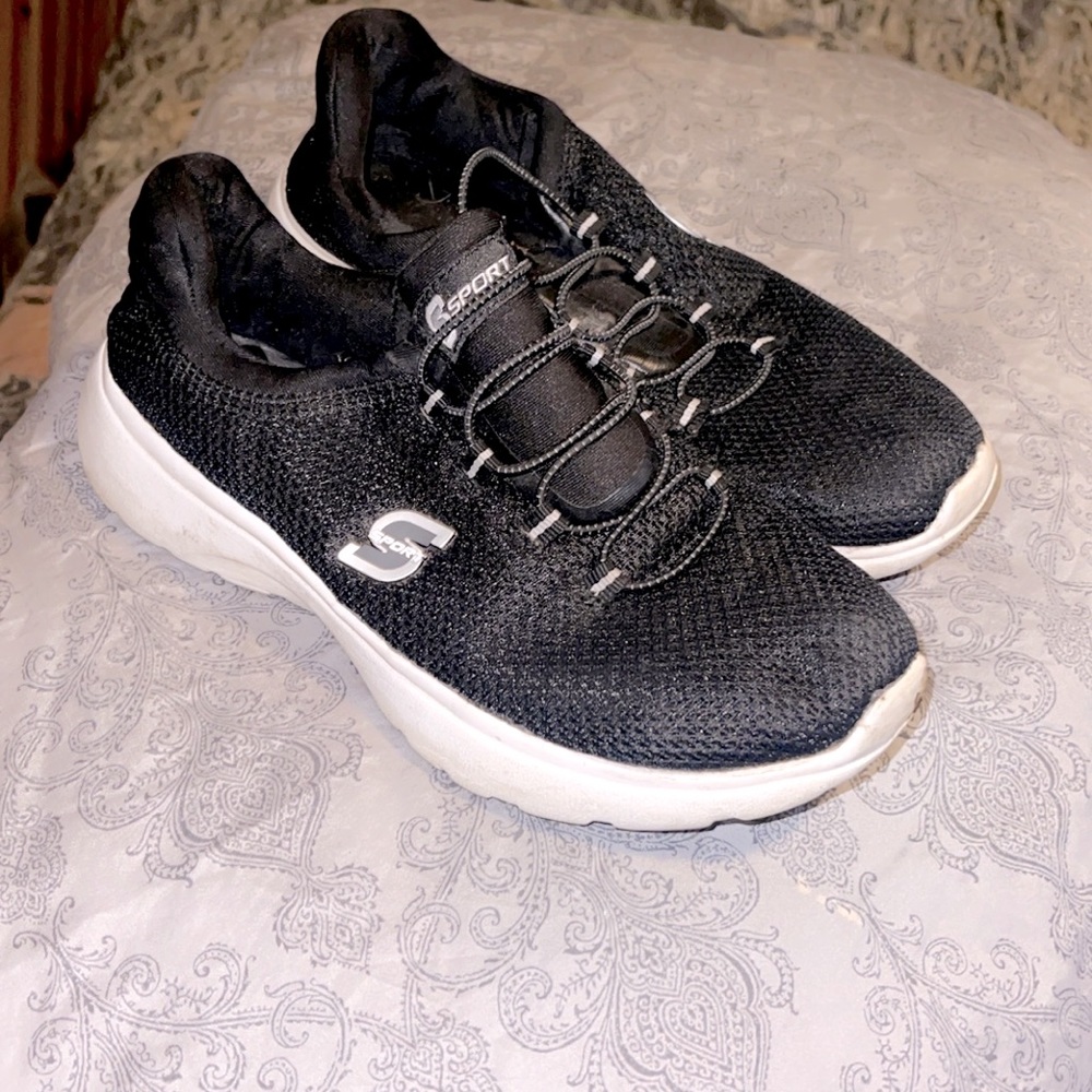 Pair of womens sketcher sport tennis shoes